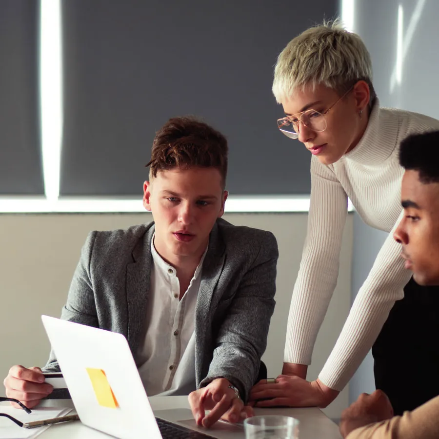 A recruitment team reviewing candidate files together